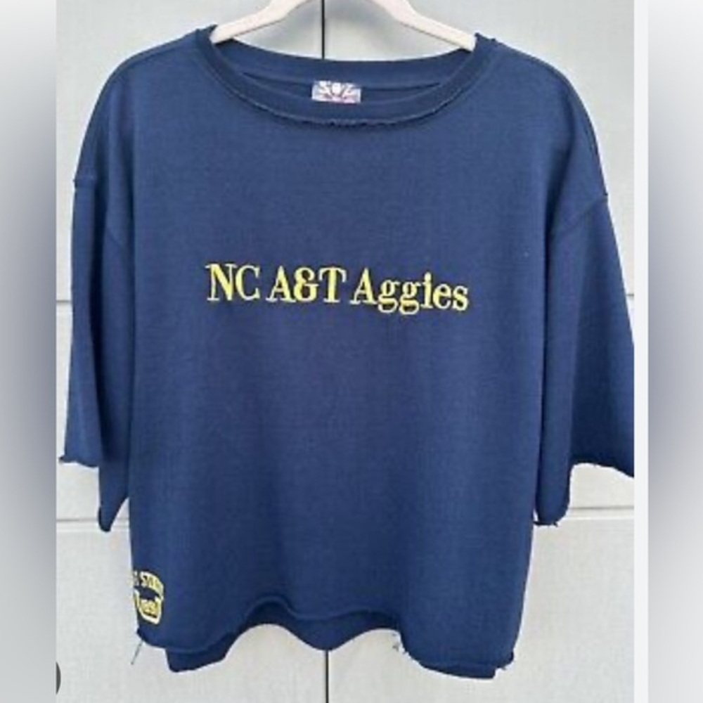 4/$50 NWOT Free people Movemenr X The class 23’ oversized NC A&T Aggies top